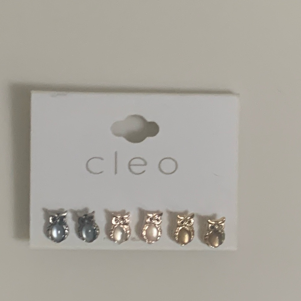 Multiple coloured owl earrings. Blue, beige, brown